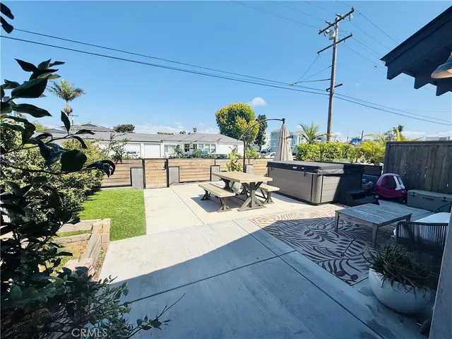 a view of a backyard with sitting area
