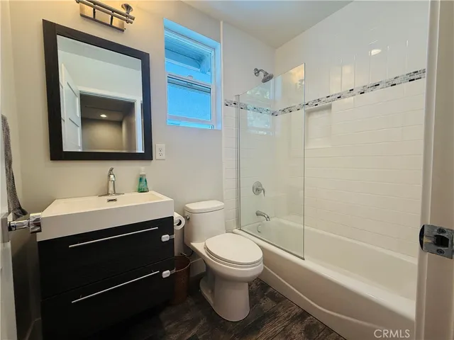 a bathroom with a sink a toilet and a bathtub
