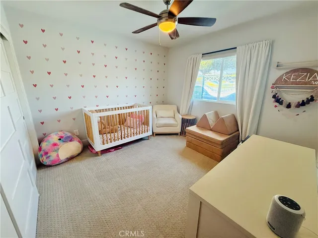 a bedroom with furniture and a window