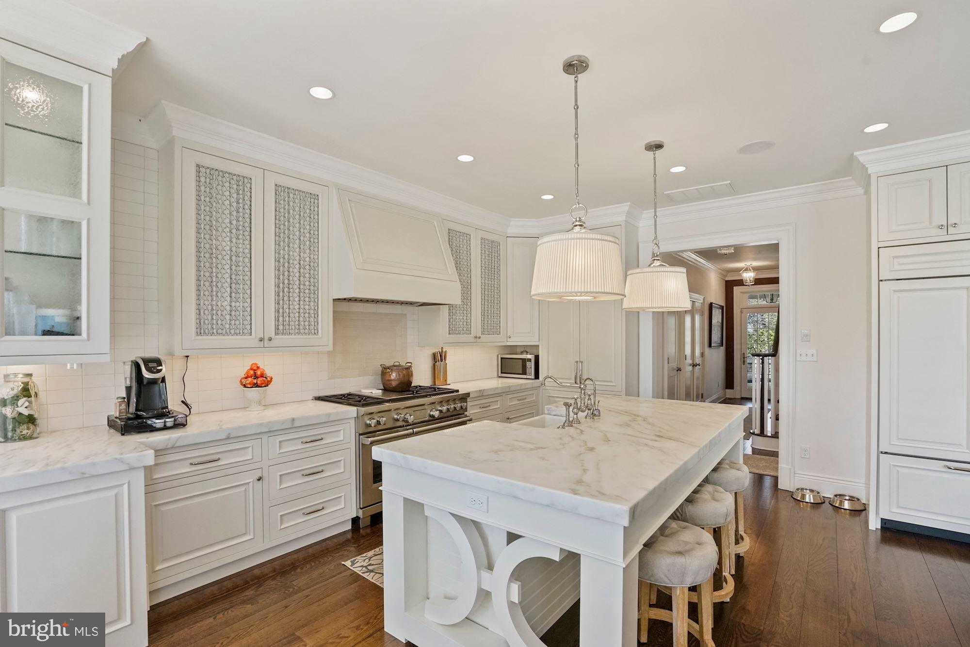 1031 Pine Hill Road McLean, VA 22101 - Photo 11 of 39 a kitchen with a sink a stove a refrigerator and white cabinets
