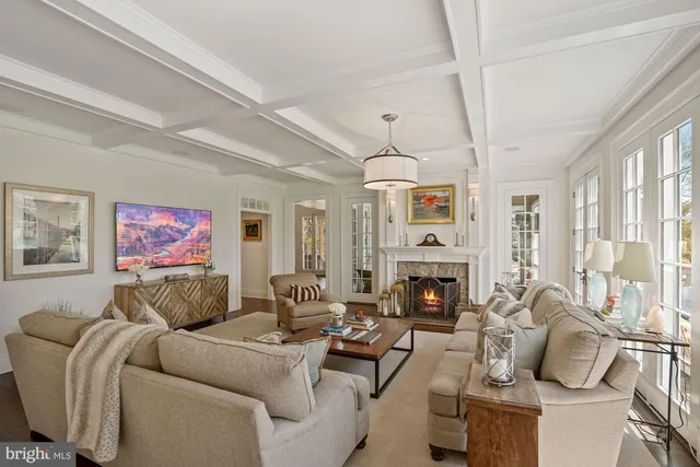 a living room with furniture fireplace and flat screen tv