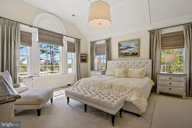 a bedroom with a bed and a couch