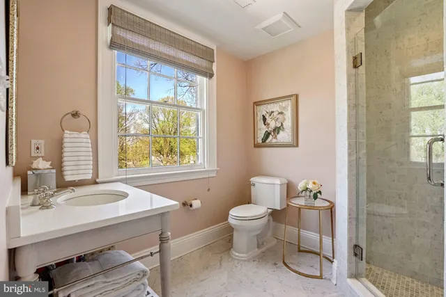 a bathroom with a sink toilet a mirror and tub
