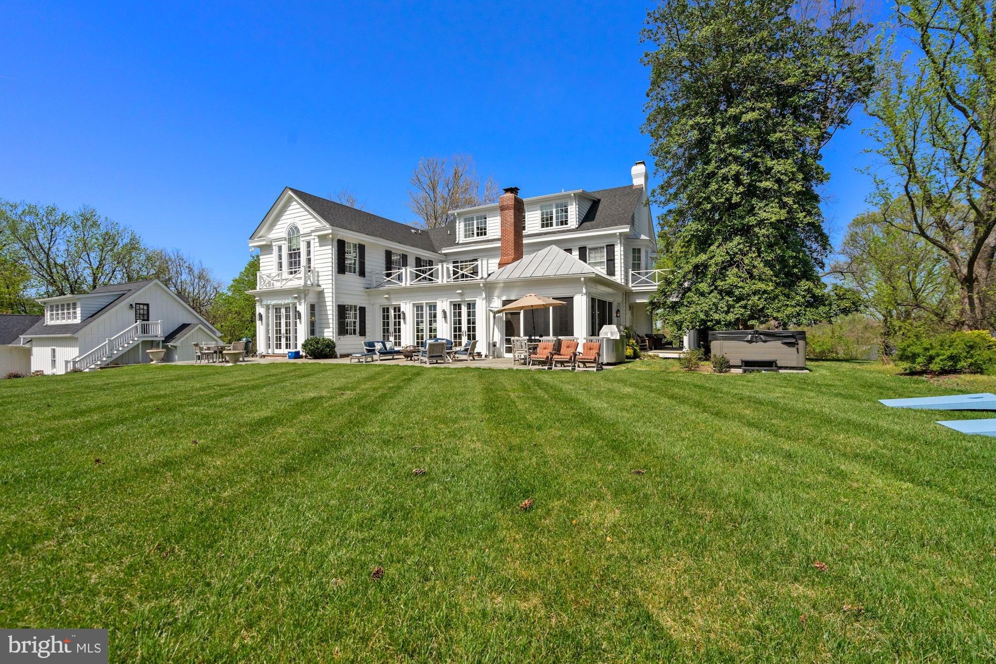 1031 Pine Hill Road McLean, VA 22101 - Photo 30 of 39 a front view of a house with a yard