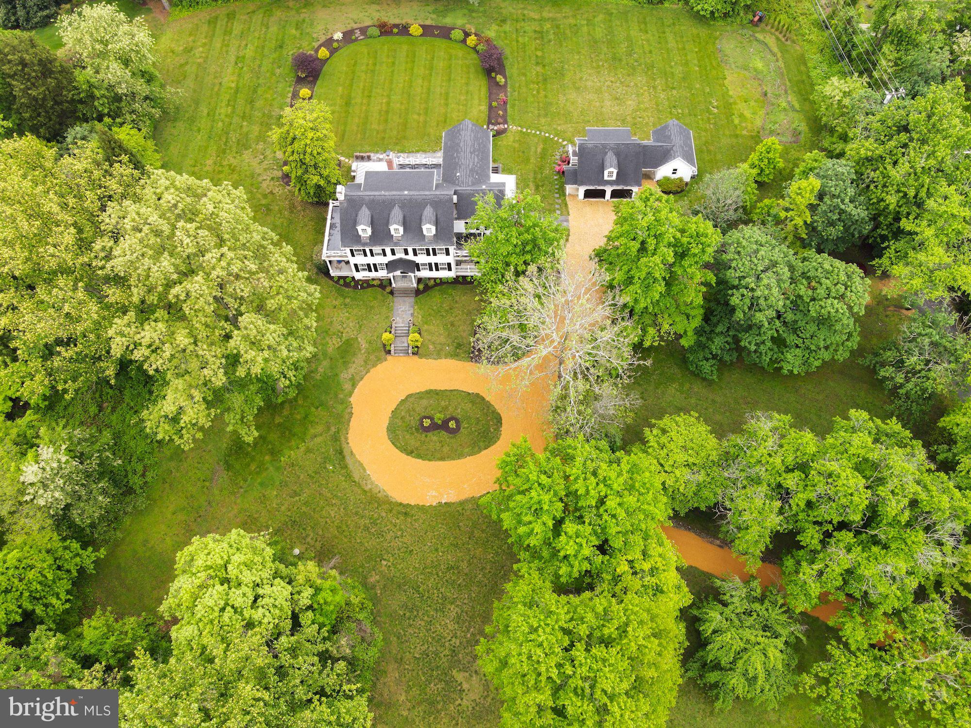 1031 Pine Hill Road McLean, VA 22101 - Photo 38 of 39 an aerial view of a house with a yard swimming pool and outdoor seating