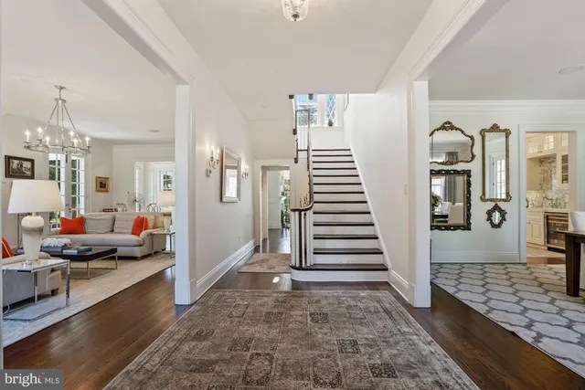 a view of a livingroom with wooden floor and a rug