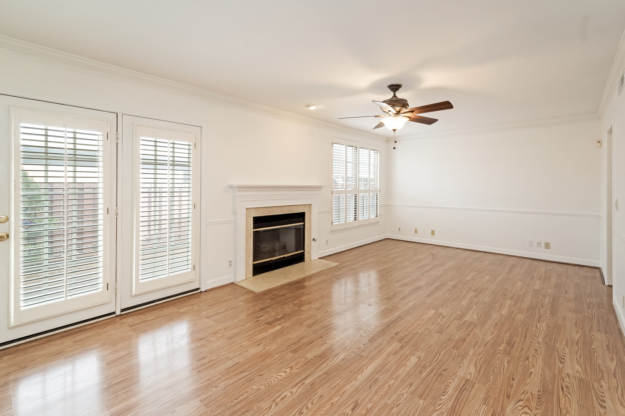 525 General George Patton Road Nashville, TN 37221 - Photo 4 of 22 a view of empty room with a fireplace and wooden floor