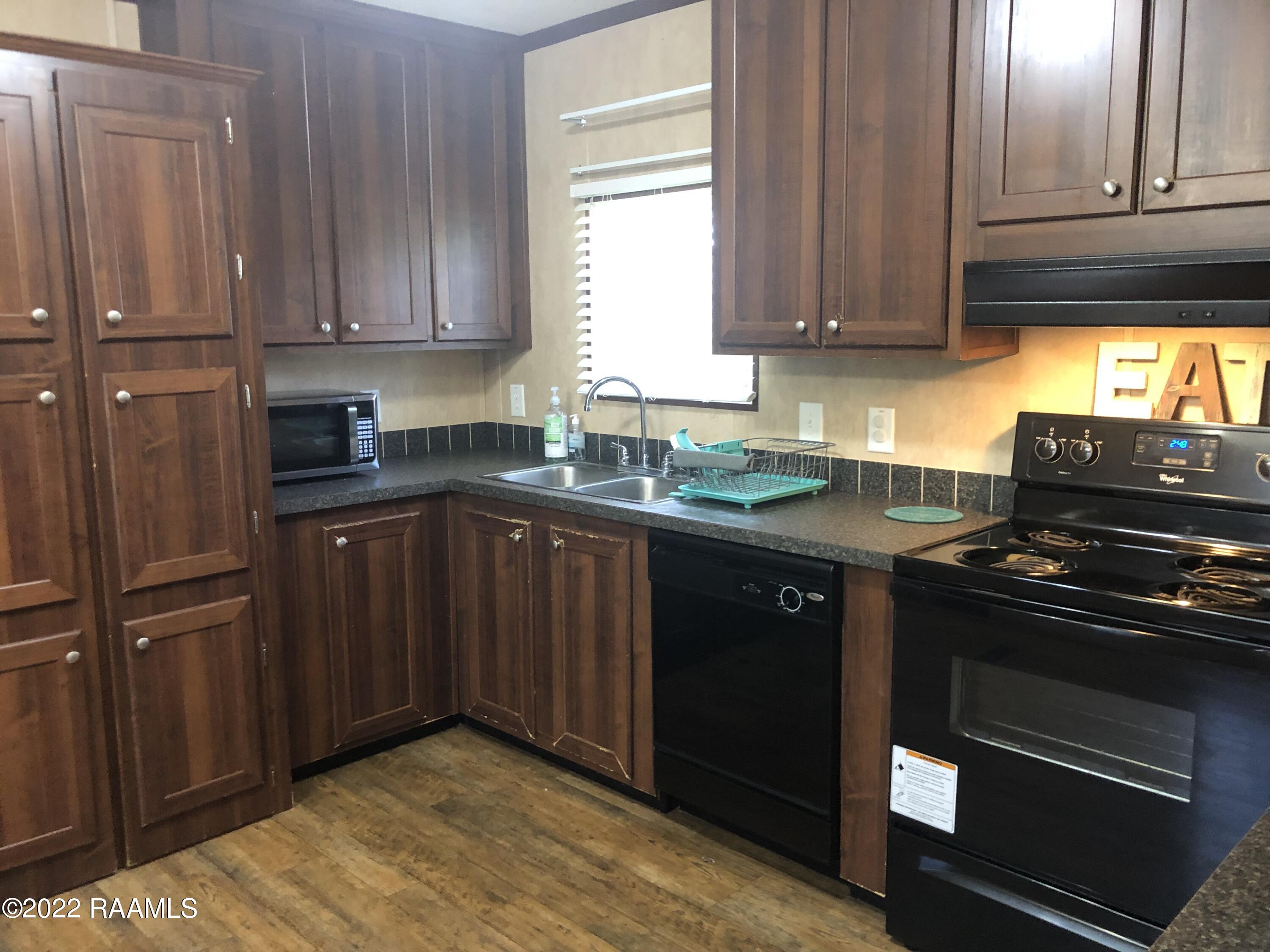 8899 Fusilier Road, Unit 16 Maurice, LA 70555 - Photo 8 of 25 Kitchen sink, range, dishwasher