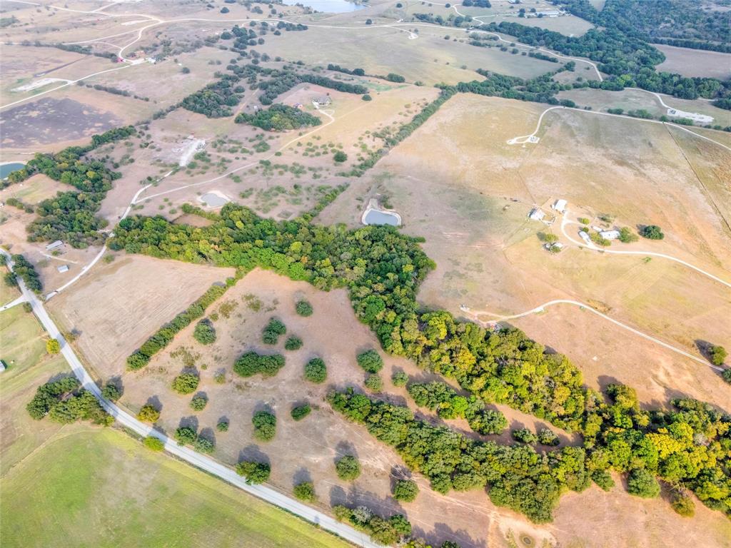 0 Deep Creek Rhome, TX 76078 - Photo 5 of 9 a view of a backyard of plants
