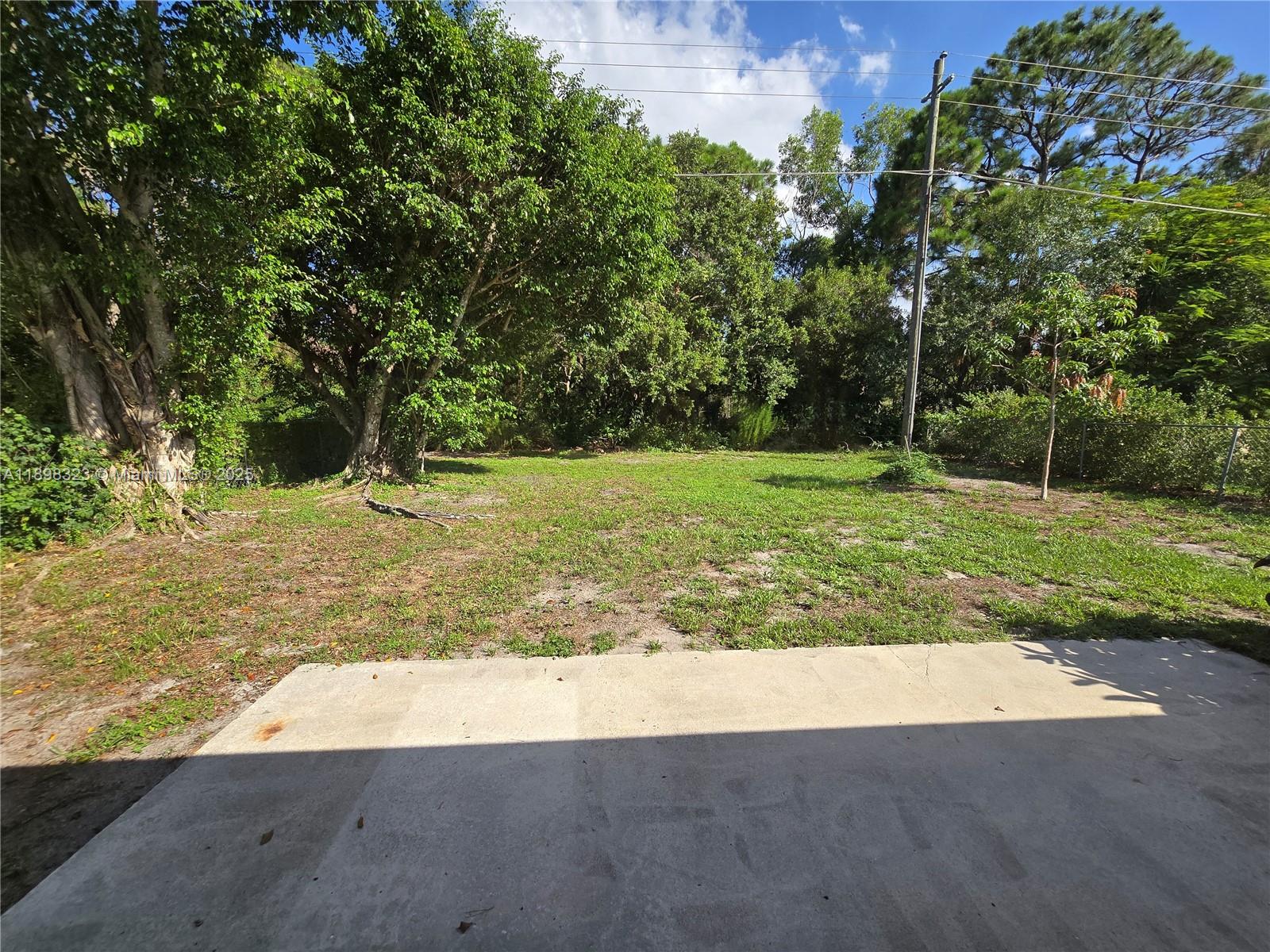 1260 Southeast St Lawrence Way Stuart, FL 34997 - Photo 11 of 14 a view of a backyard