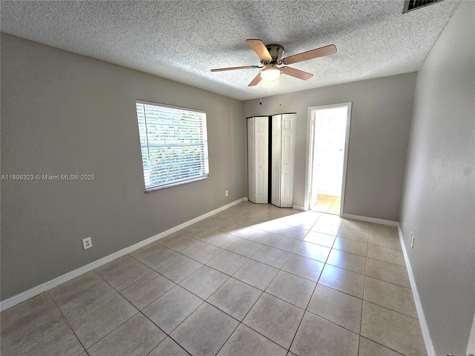 1260 Southeast St Lawrence Way Stuart, FL 34997 - Photo 12 of 14 a view of an empty room with a window