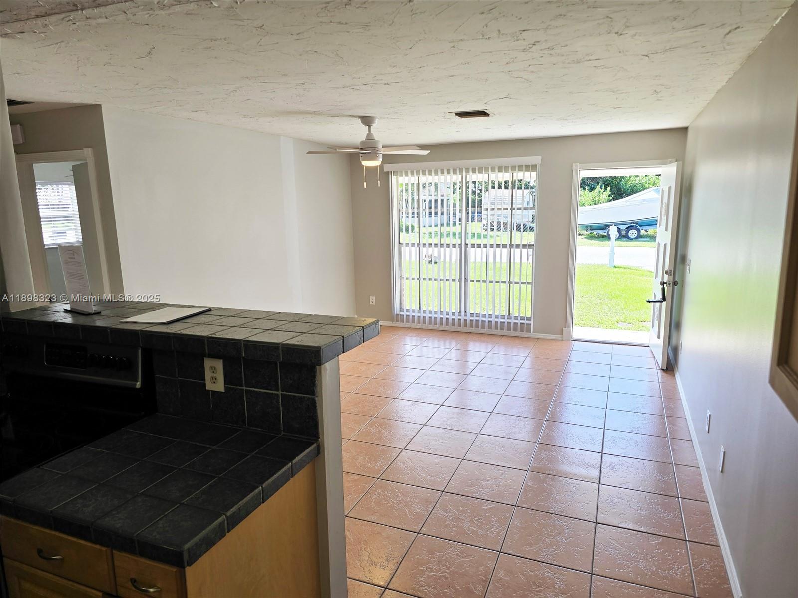 1260 Southeast St Lawrence Way Stuart, FL 34997 - Photo 3 of 14 a view of an empty room with a window