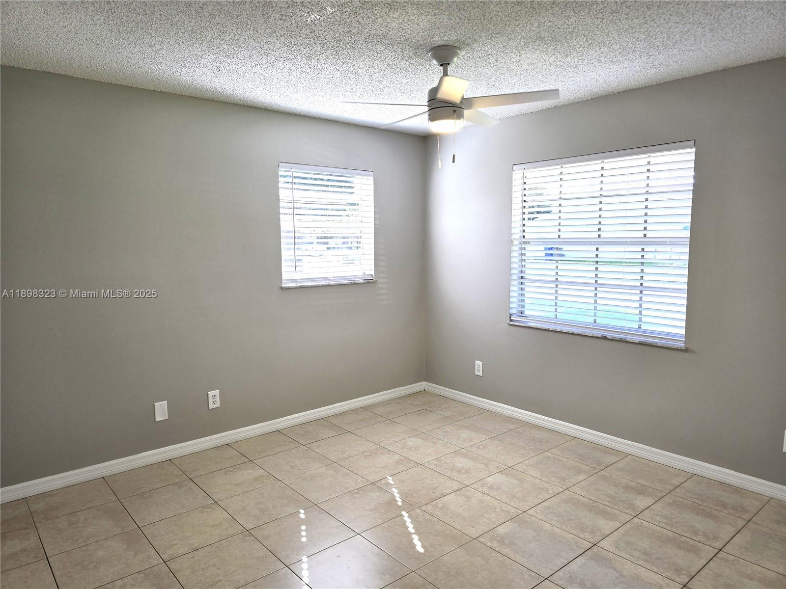1260 Southeast St Lawrence Way Stuart, FL 34997 - Photo 6 of 14 a view of an empty room with windows