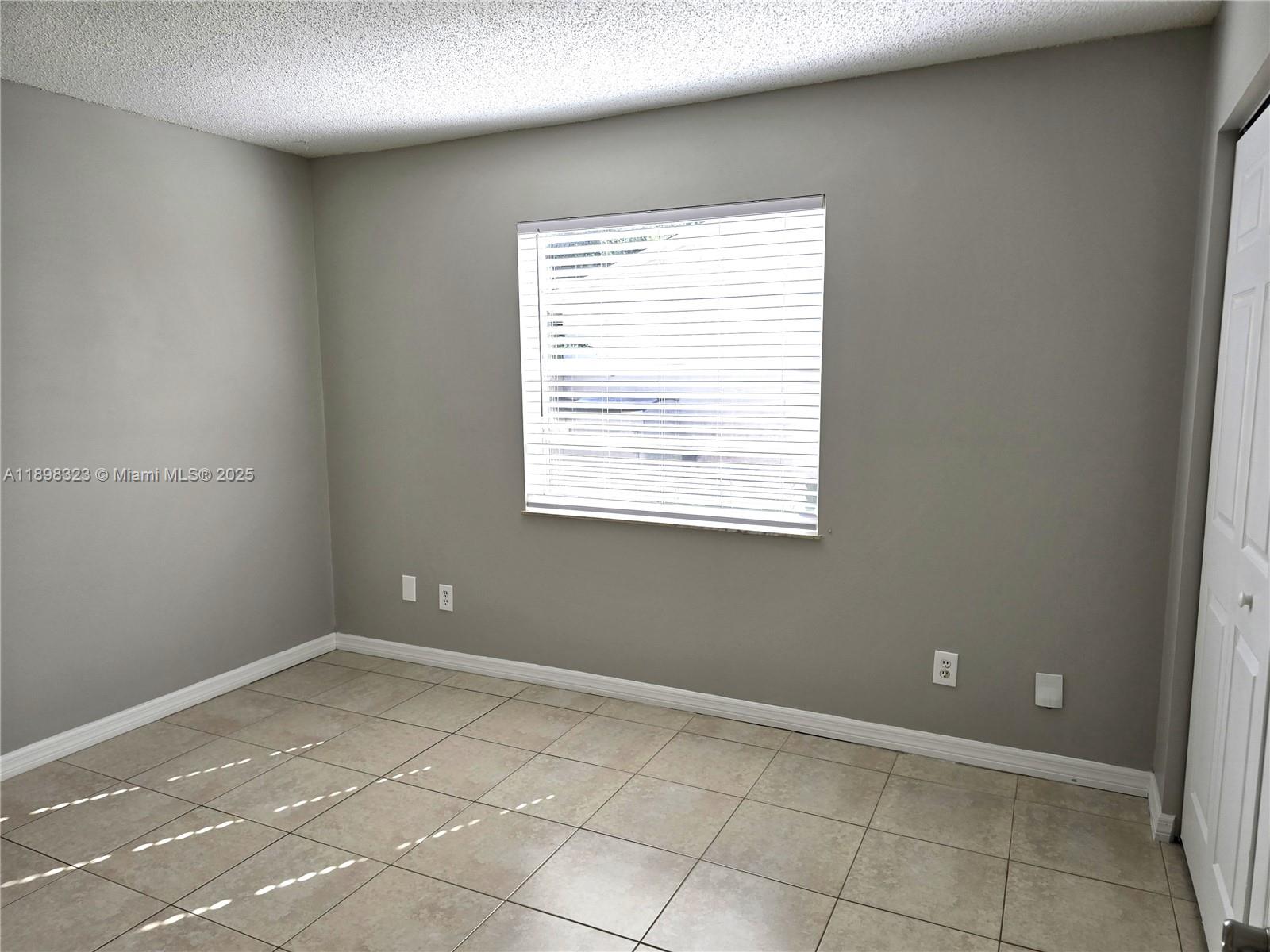 1260 Southeast St Lawrence Way Stuart, FL 34997 - Photo 7 of 14 an empty room with windows