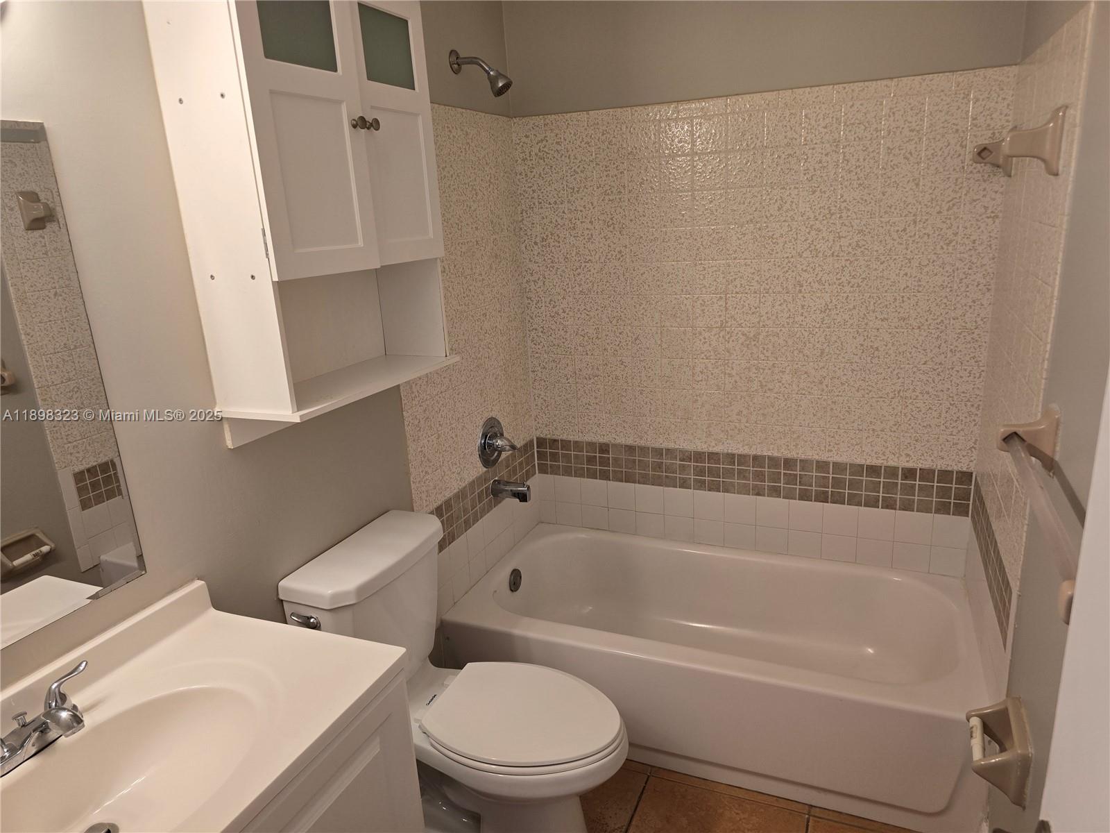 1260 Southeast St Lawrence Way Stuart, FL 34997 - Photo 8 of 14 a bathroom with a sink toilet and shower