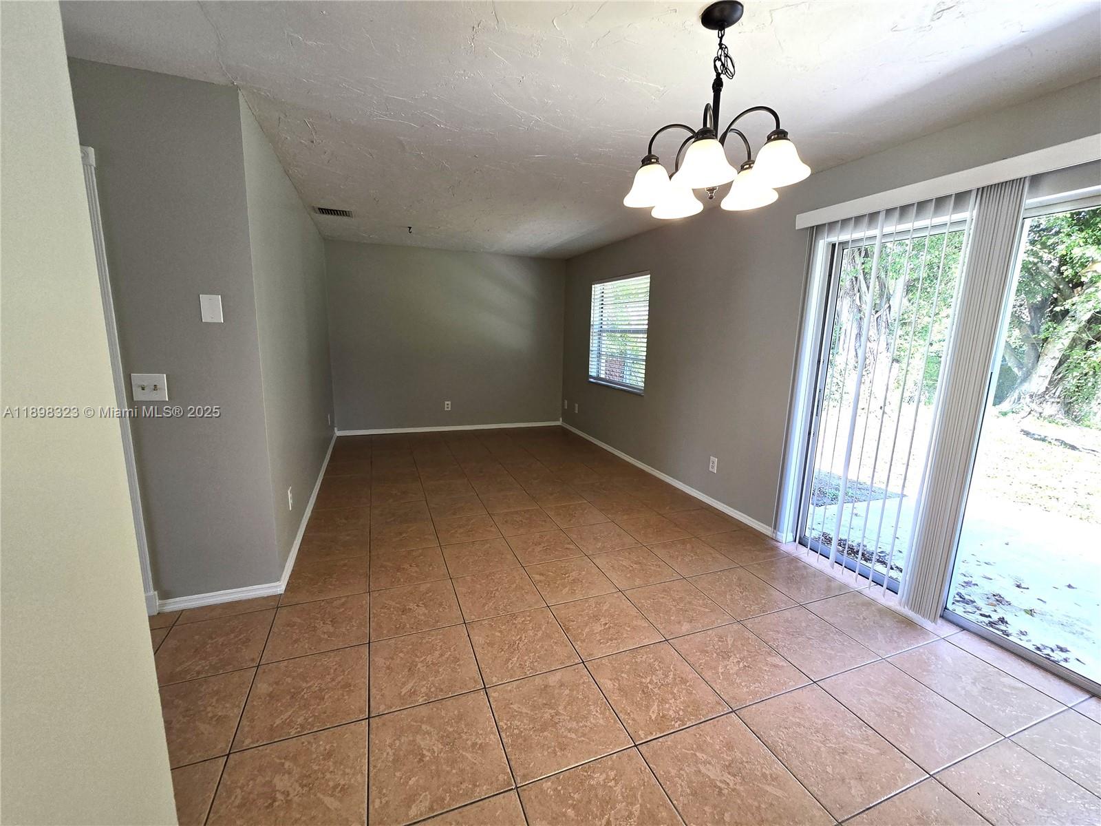 1260 Southeast St Lawrence Way Stuart, FL 34997 - Photo 10 of 14 a view of an empty room with a window
