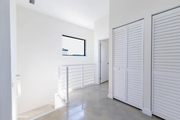 a view of a hallway with closet