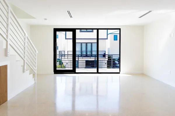 a view of an empty room with a large window