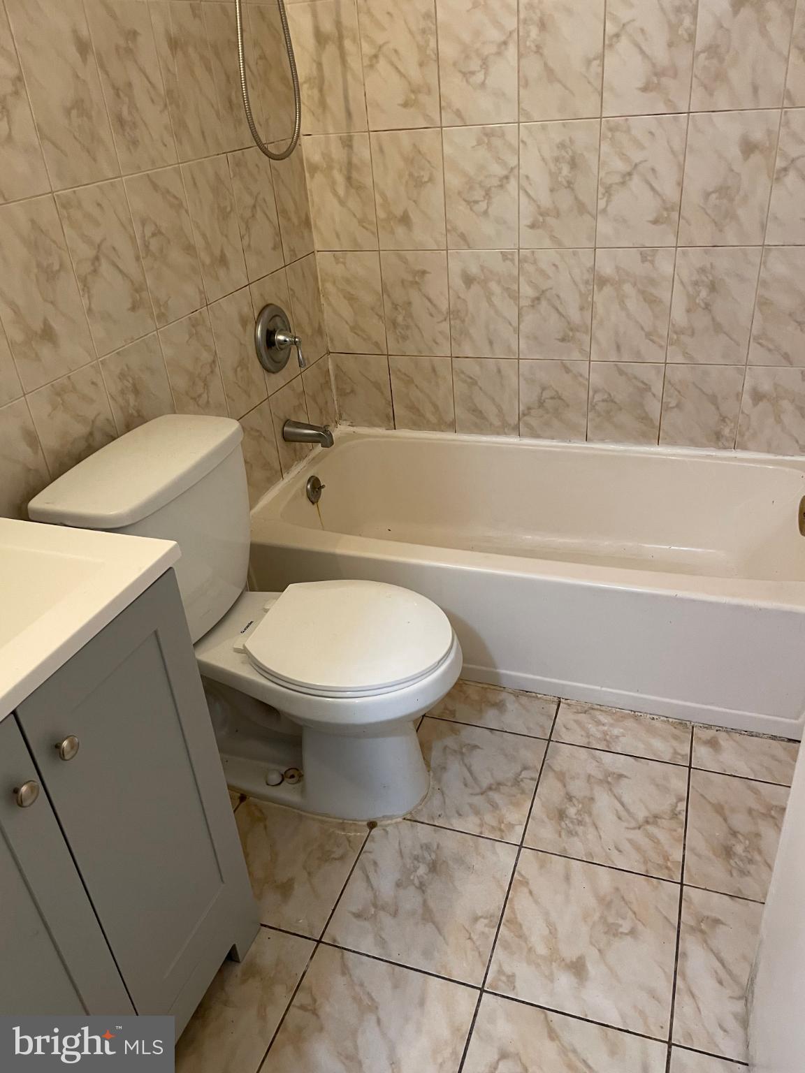 553 Foster Street, Unit 1 Philadelphia, PA 19116 - Photo 2 of 8 a bathroom with a toilet and a shower
