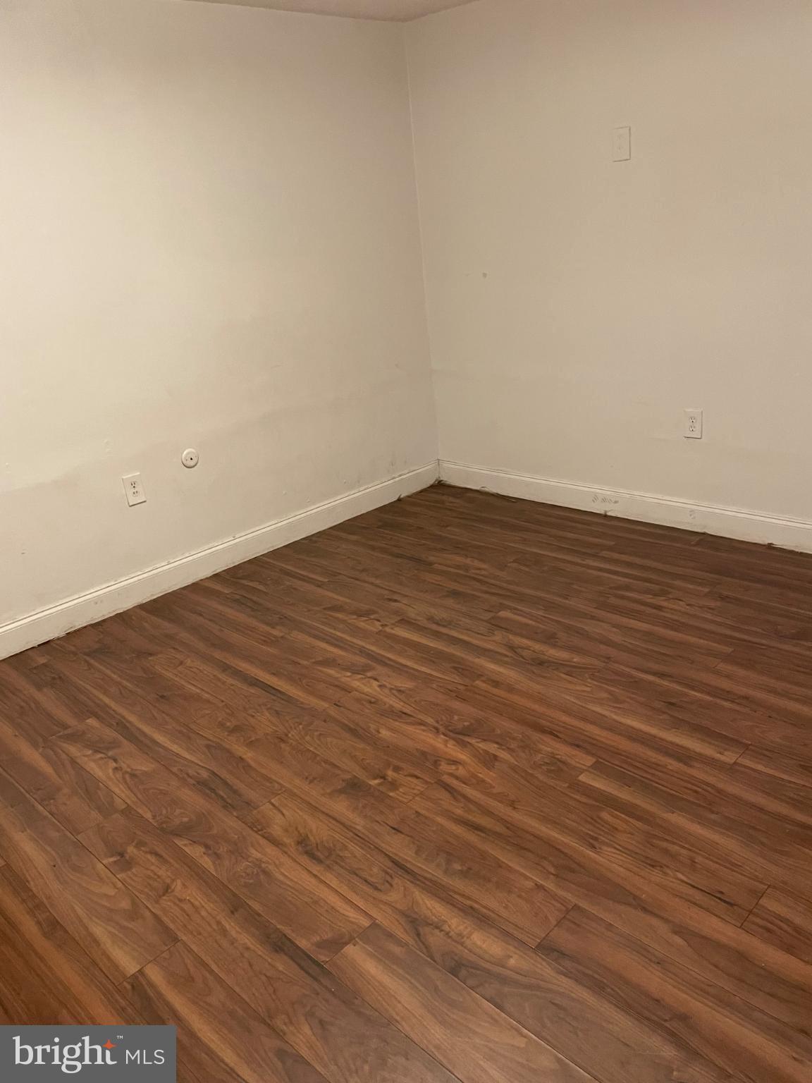 553 Foster Street, Unit 1 Philadelphia, PA 19116 - Photo 3 of 8 a view of an empty room with wooden floor