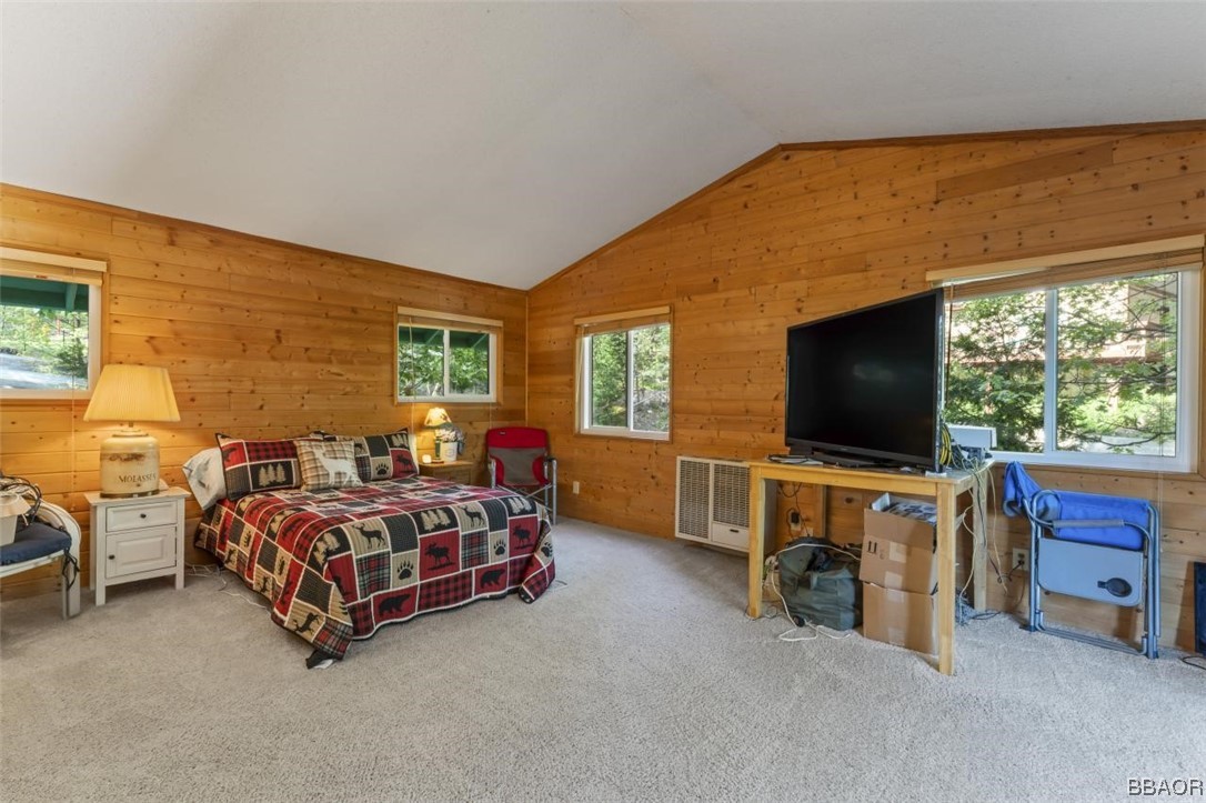 623 Highway 138 Crestline, CA 92325 - Photo 13 of 24 a room with a bed and a flat screen tv