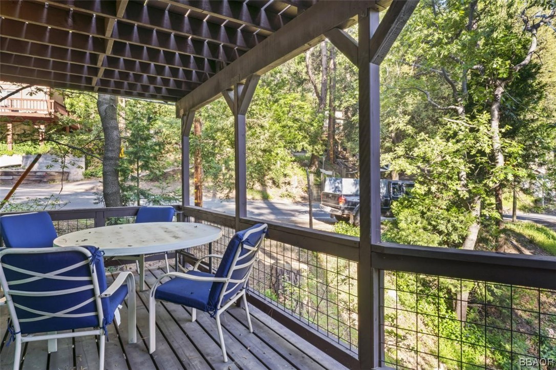 623 Highway 138 Crestline, CA 92325 - Photo 22 of 24 a view of a porch with furniture and wooden floor