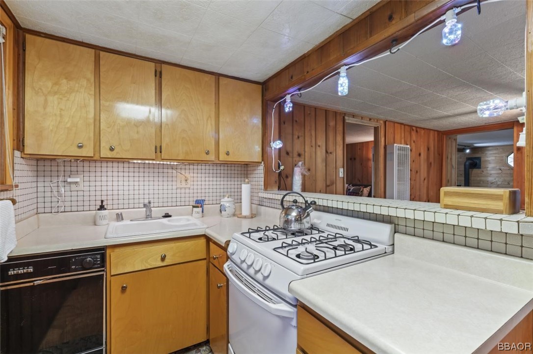 623 Highway 138 Crestline, CA 92325 - Photo 7 of 24 a kitchen with a sink a stove and cabinets