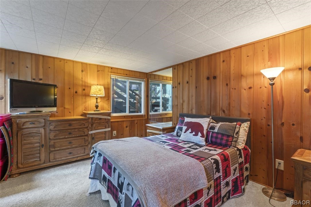 623 Highway 138 Crestline, CA 92325 - Photo 9 of 24 a bedroom with a bed and a flat screen tv