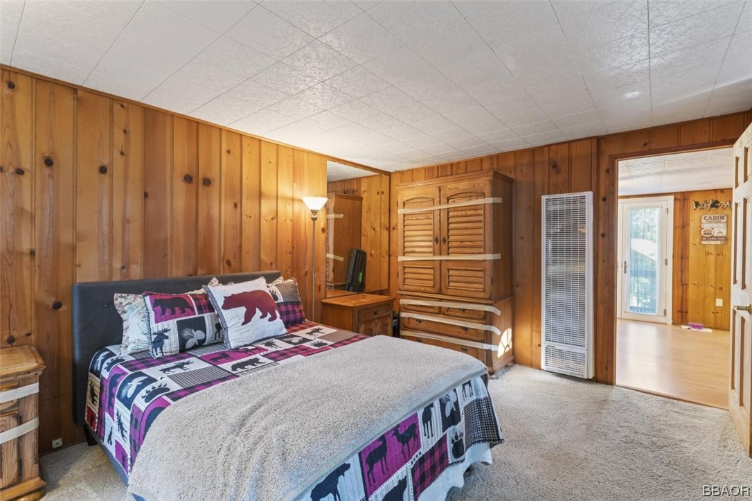 623 Highway 138 Crestline, CA 92325 - Photo 10 of 24 a bedroom with a bed and wooden floor