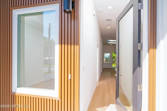a view of a bathroom from a hallway