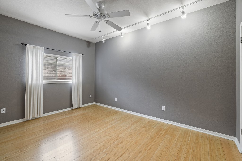 347 Spring Drive Kyle, TX 78640 - Photo 27 of 40 Luminous hard wood flooring enhances the spaciousness of this versatile room.