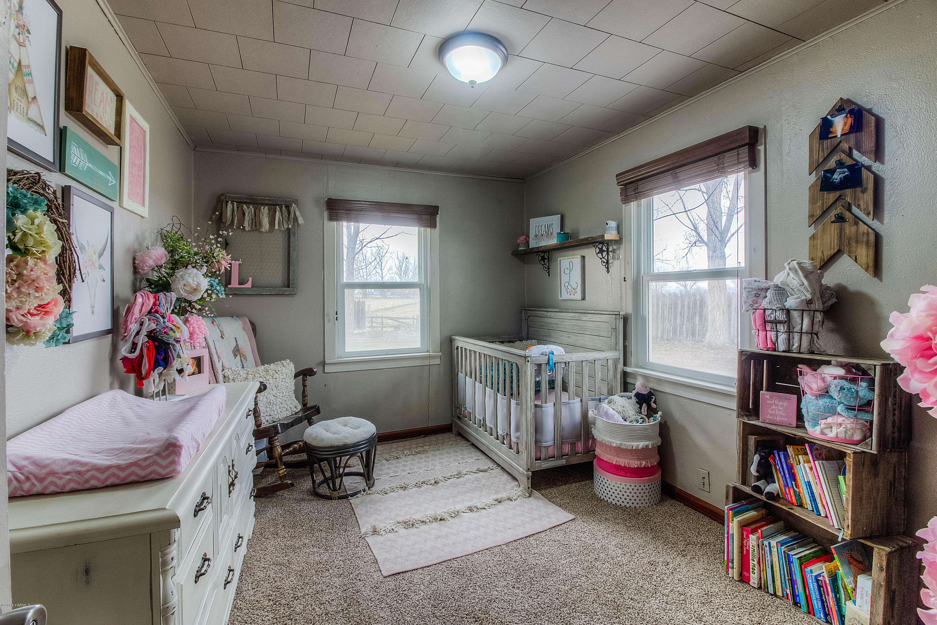 1091 Northbank Road Outlook, WA 98938 - Photo 11 of 18 a bedroom with furniture and a book shelf