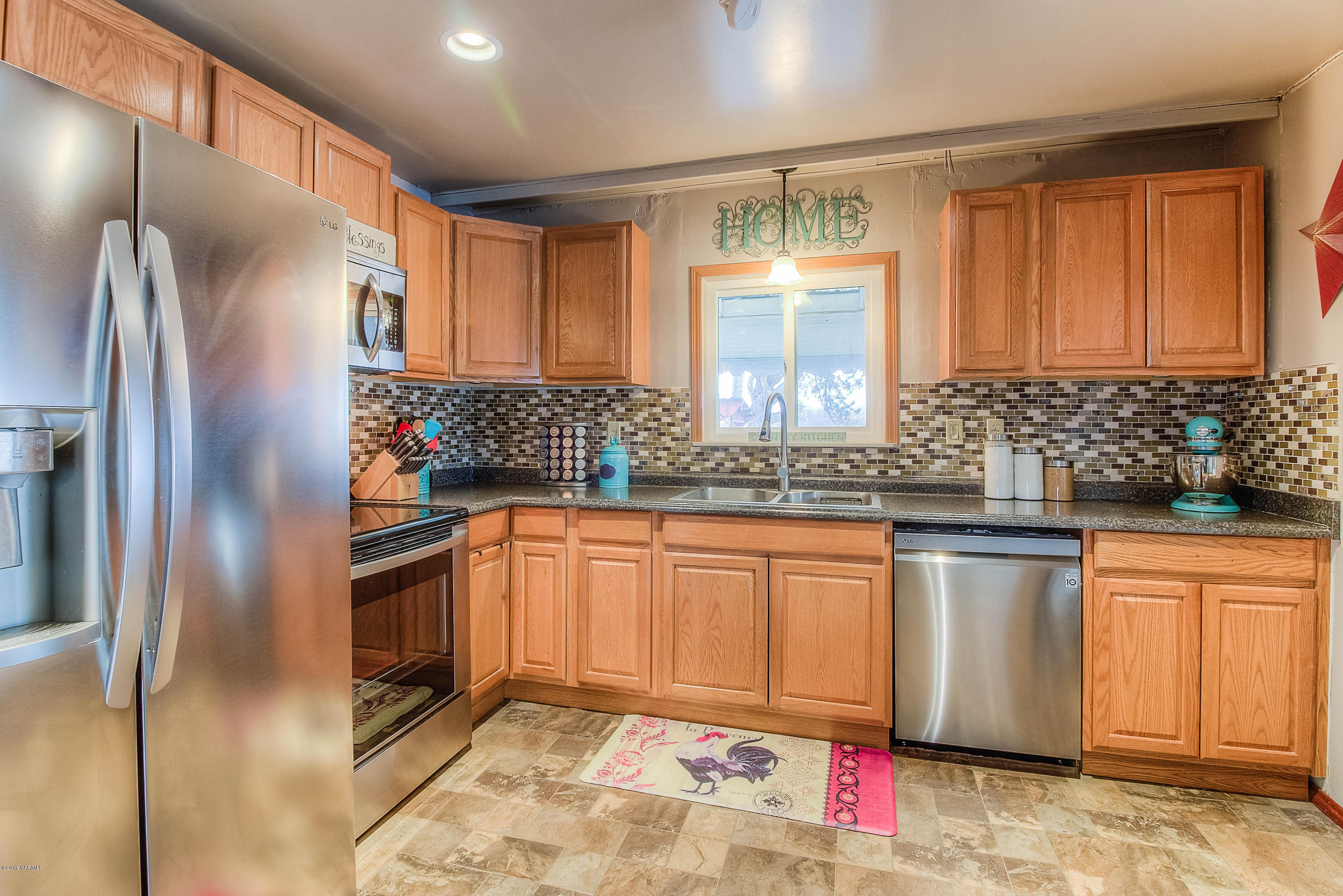 1091 Northbank Road Outlook, WA 98938 - Photo 6 of 18 a kitchen with stainless steel appliances granite countertop a refrigerator and a sink