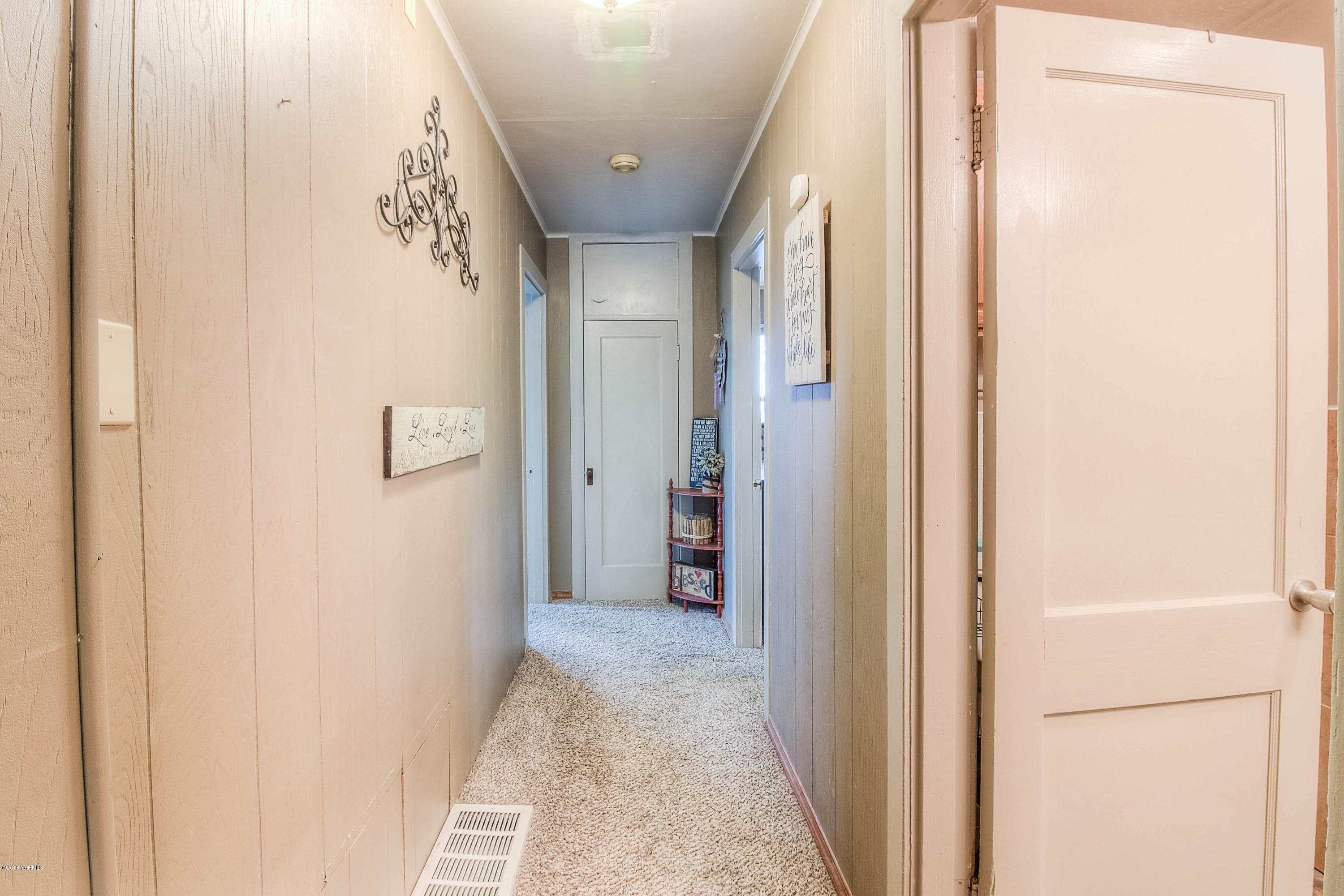 1091 Northbank Road Outlook, WA 98938 - Photo 9 of 18 a view of a hallway with wooden shelves