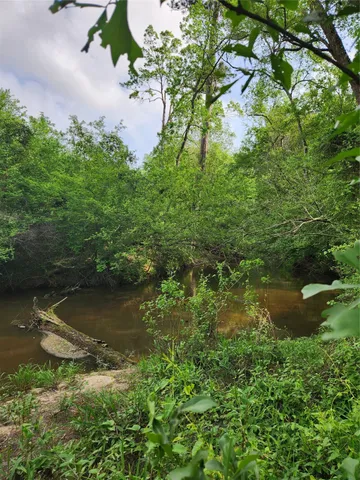 a view of a lake with a yard
