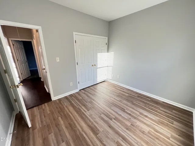 a view of a livingroom with wooden floor