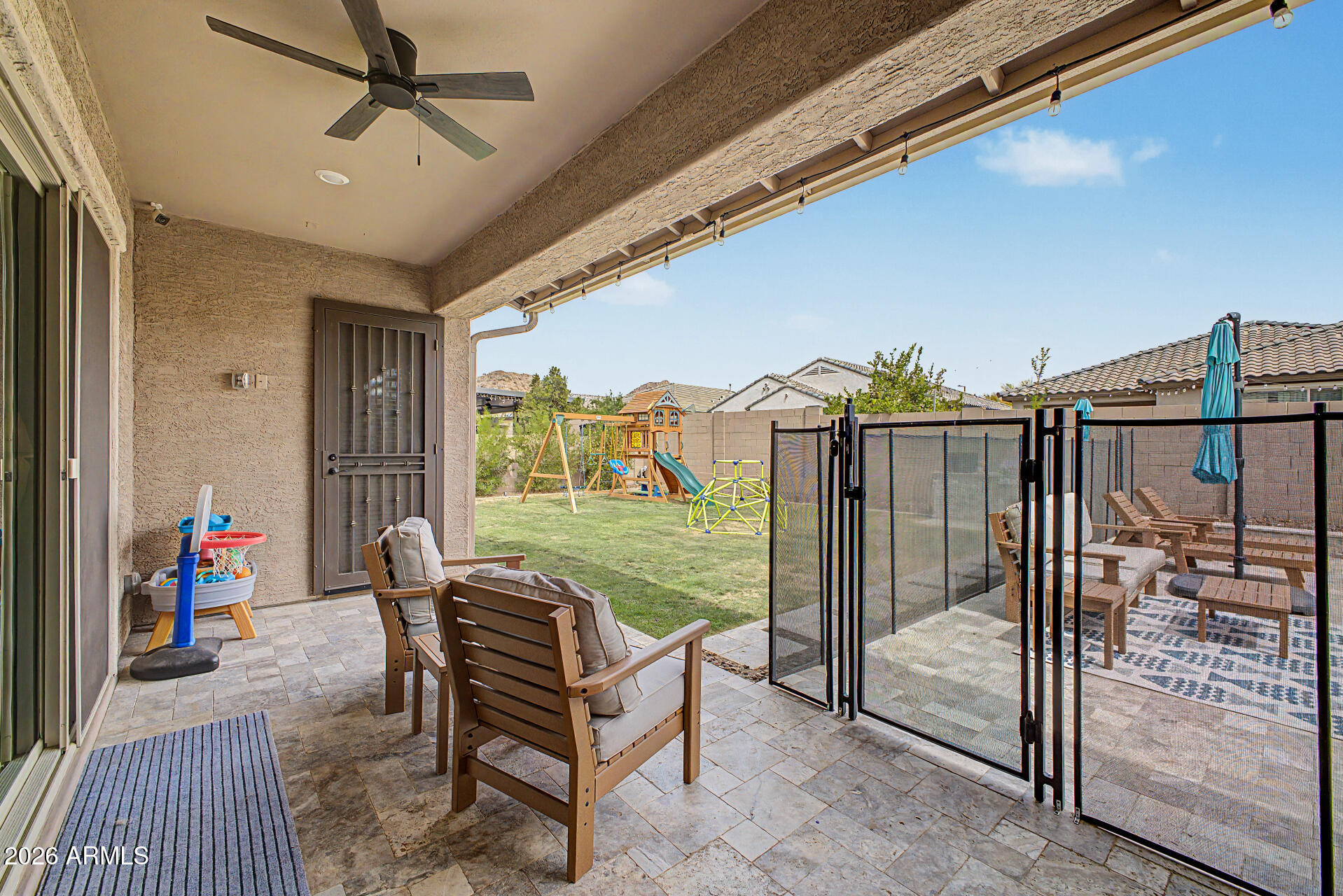 6511 West Steed Ridge Phoenix, AZ 85083 - Photo 32 of 41 a view of a porch with furniture and a yard