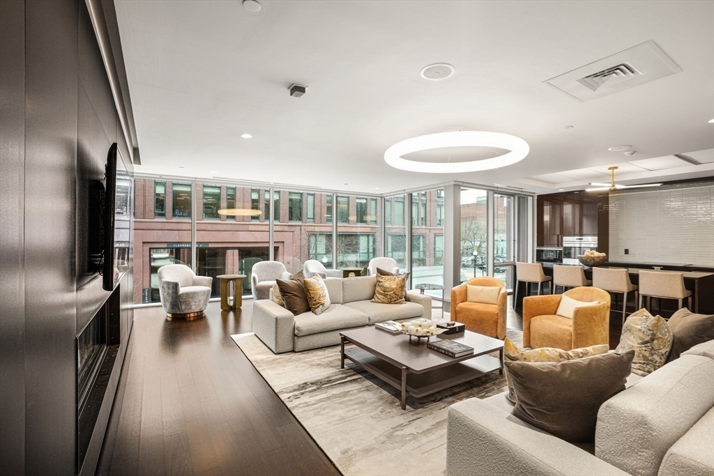 32 Traveler Street, Unit 411 Boston, MA 02118 - Photo 16 of 22 a living room with furniture and a fireplace