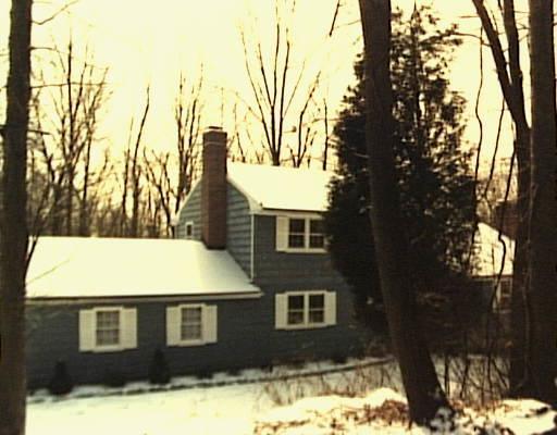 143 Cavalry Road Wilton, CT 06897 - Photo 1 of 1 a front view of a house with a yard