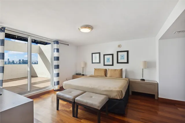 a bed room with a bed and a couch