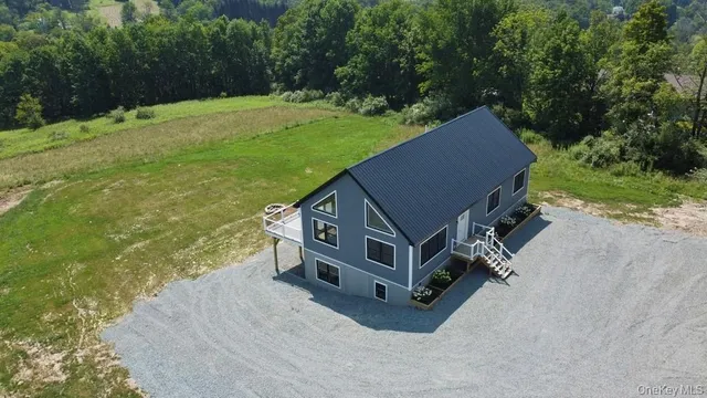a aerial view of a house with a yard