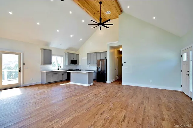 a view of kitchen with cabinets and wooden floor