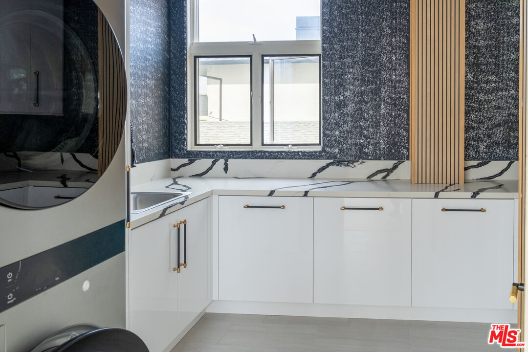 147 Napoleon Street Playa del Rey, CA 90293 - Photo 33 of 33 a bathroom with a sink and a washing machine