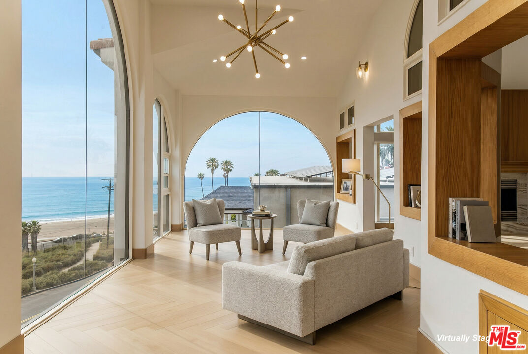 147 Napoleon Street Playa del Rey, CA 90293 - Photo 4 of 33 a living room with furniture a fireplace and a large window