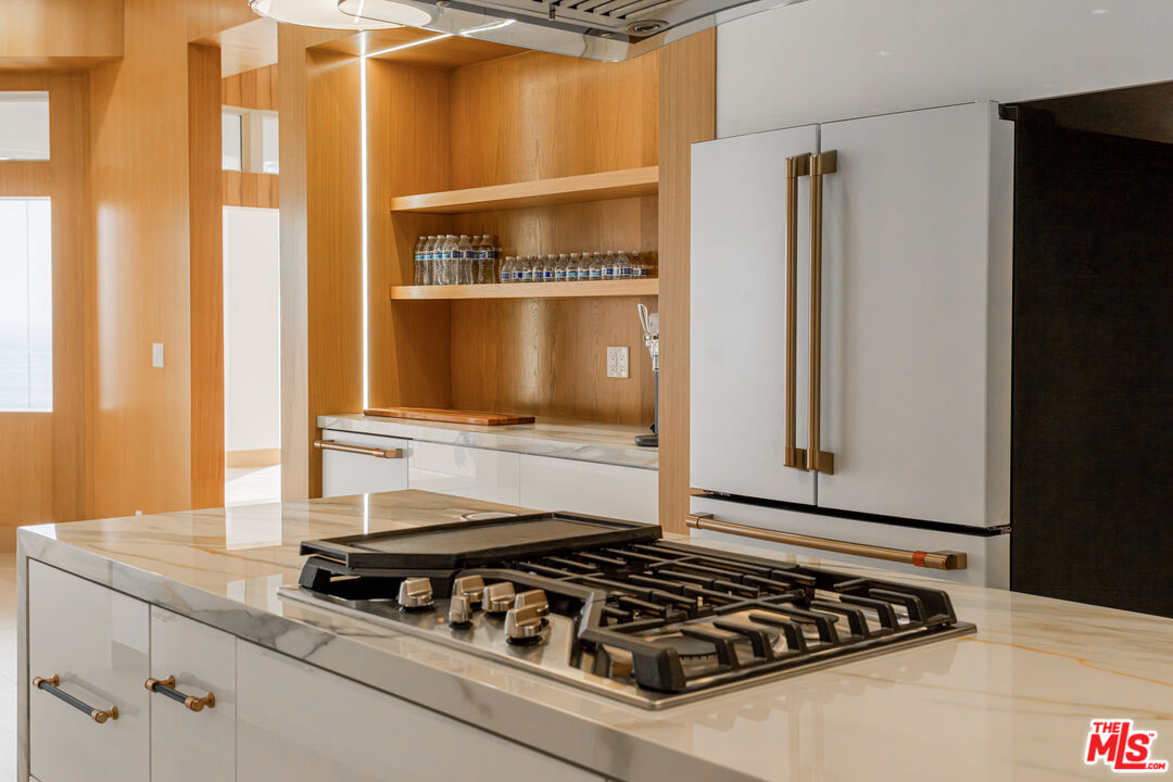 147 Napoleon Street Playa del Rey, CA 90293 - Photo 10 of 33 a kitchen with granite countertop a stove and a refrigerator