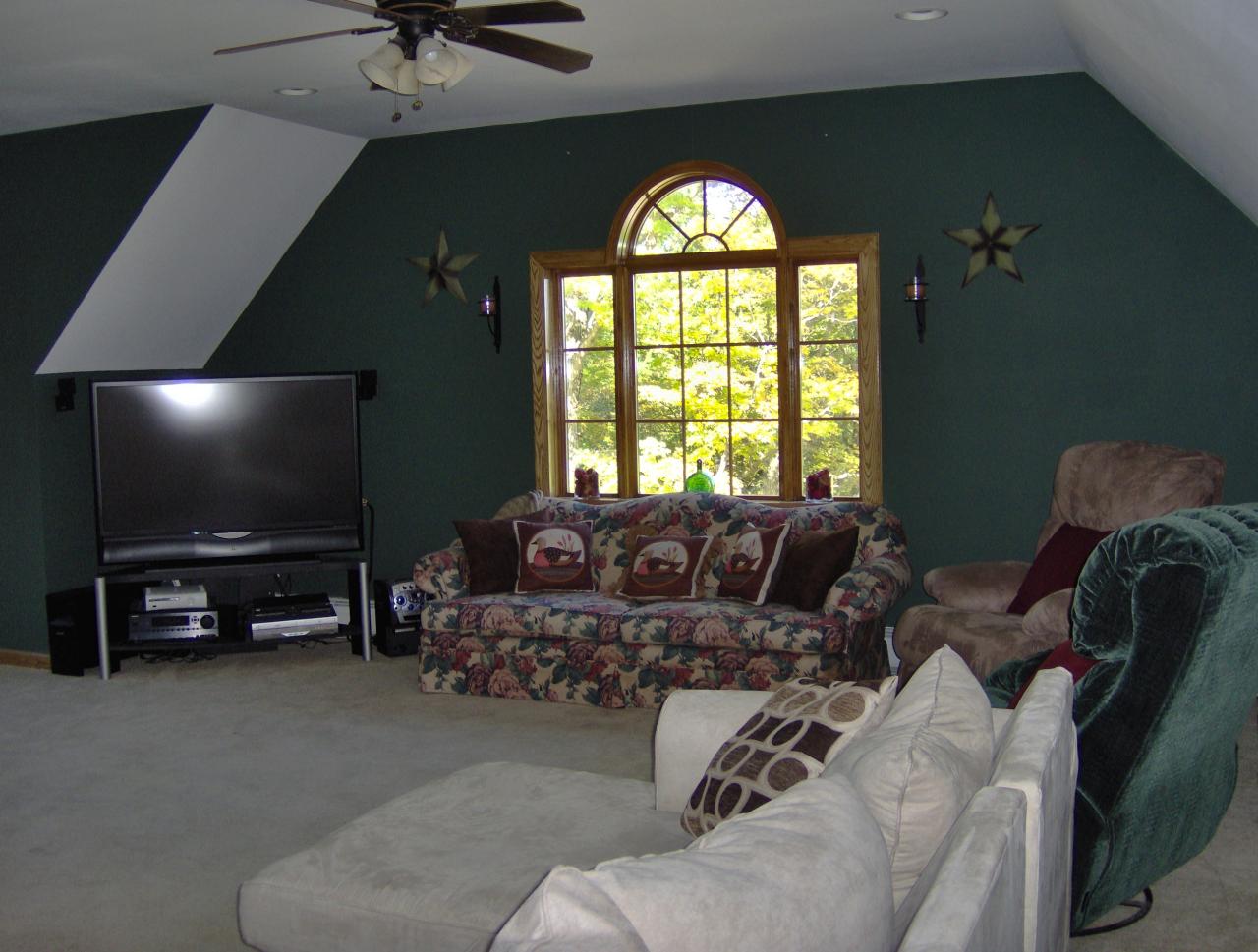 998 Williamsburg Road Ashfield, MA 01330 - Photo 22 of 46 a living room with furniture and a flat screen tv