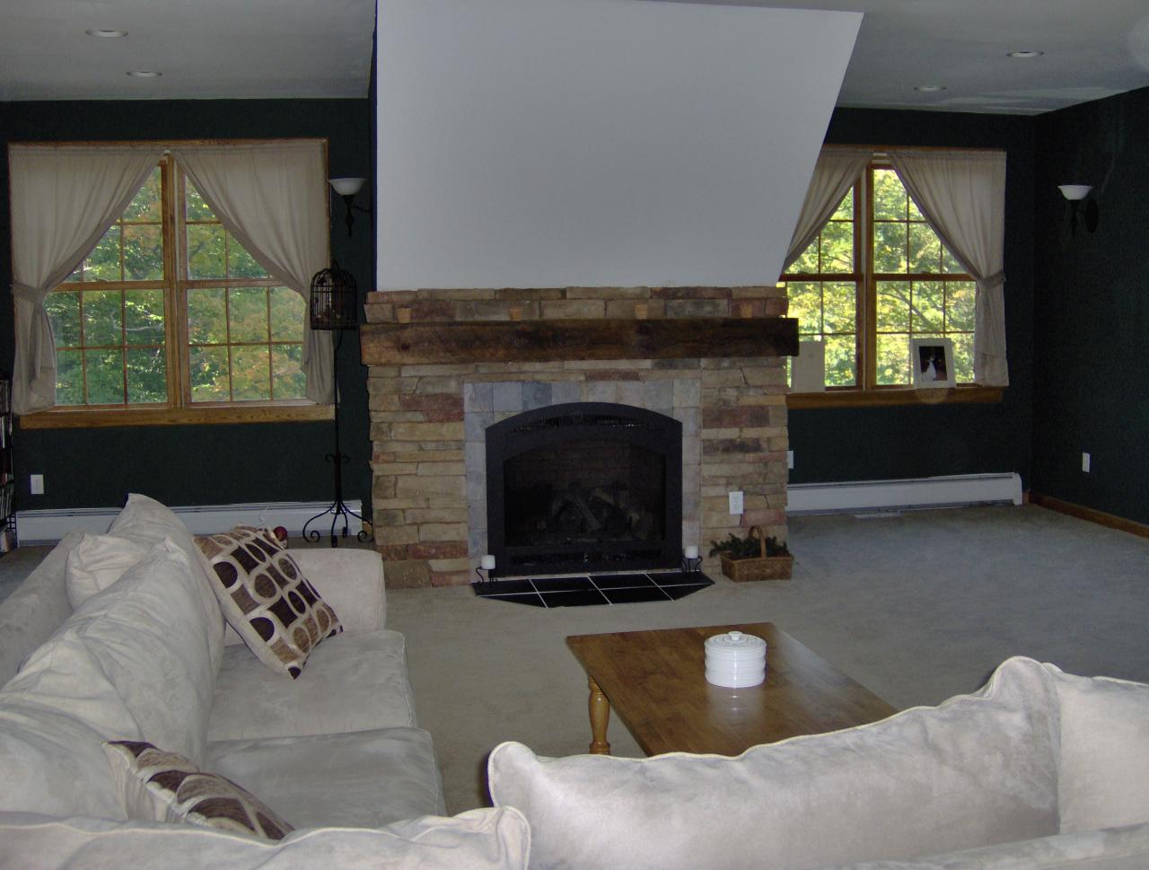 998 Williamsburg Road Ashfield, MA 01330 - Photo 4 of 46 a living room with furniture and a fireplace