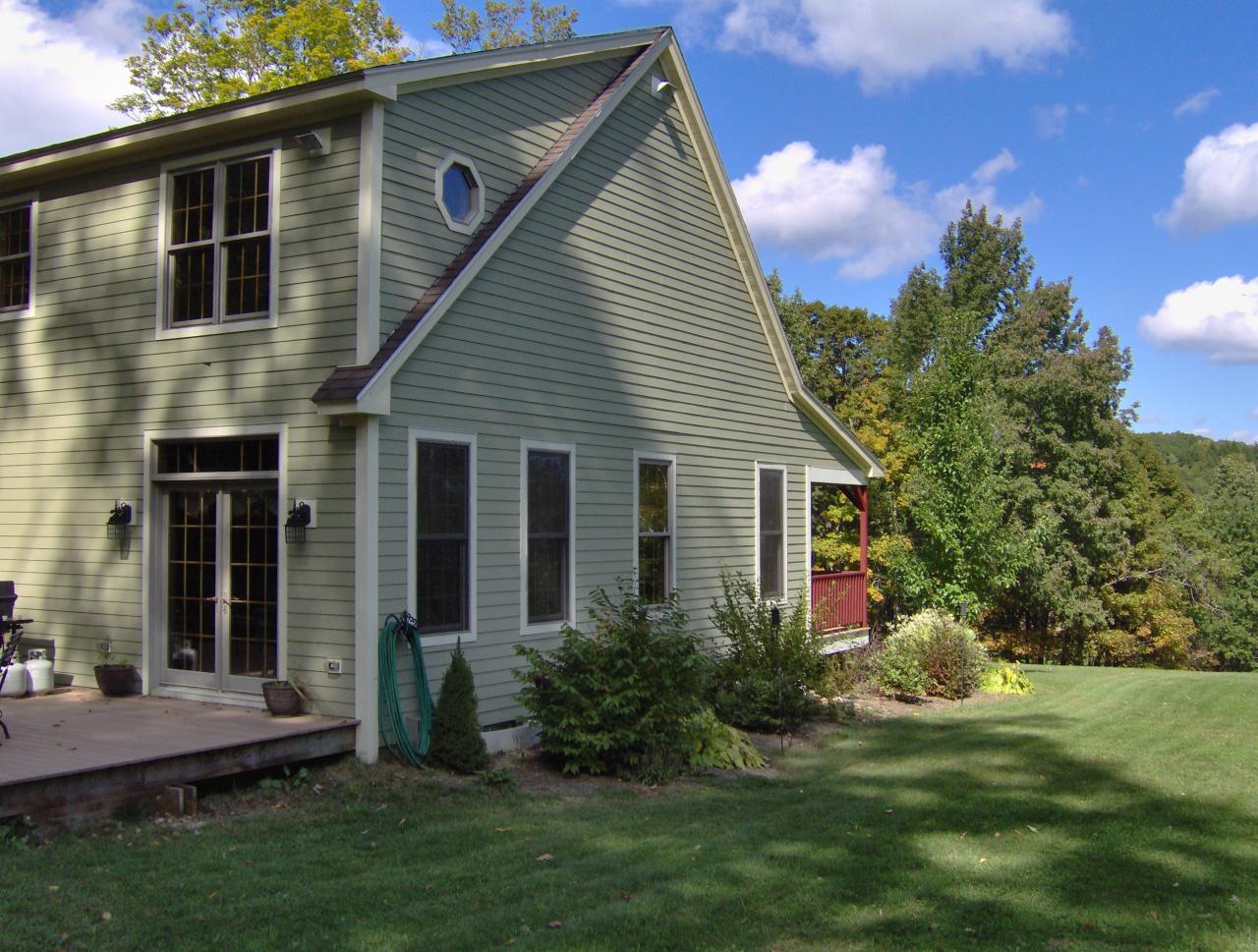 998 Williamsburg Road Ashfield, MA 01330 - Photo 40 of 46 a front view of a house with a yard