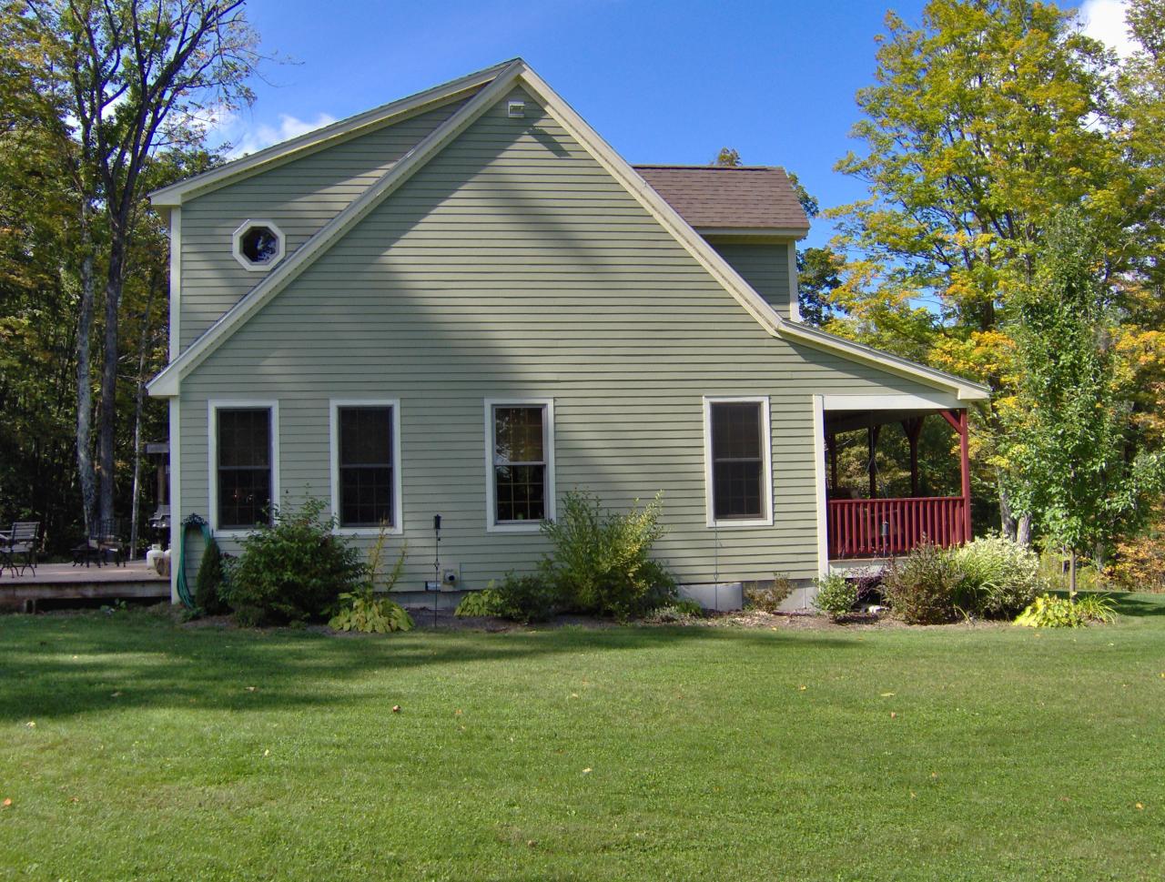 998 Williamsburg Road Ashfield, MA 01330 - Photo 41 of 46 a front view of house with yard and green space