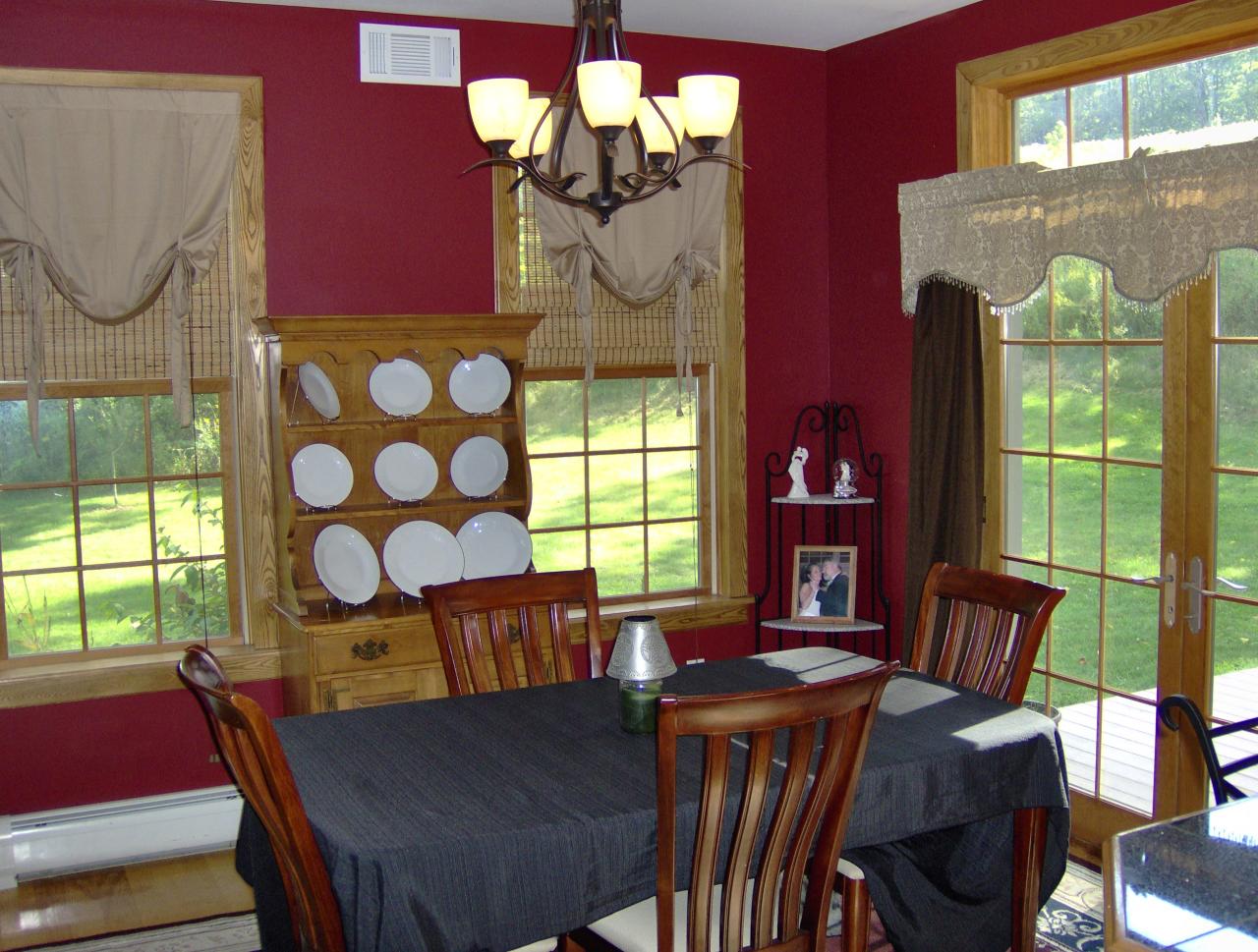 998 Williamsburg Road Ashfield, MA 01330 - Photo 9 of 46 a view of a dining room with furniture a chandelier and large windows